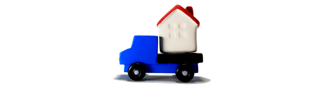 Toy house on back of toy lorry