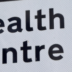 Direction sign to health centre
