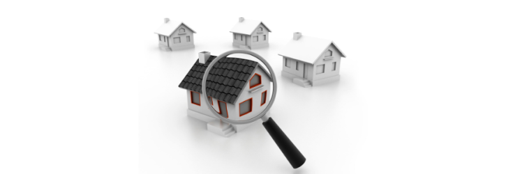 Viewing a small house through a magnifying glass