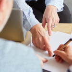 Couple signing a legal document