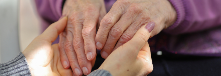 Holding elderly hands