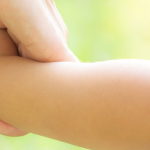 Child and parent holding hands