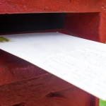 Letter being posted in postbox