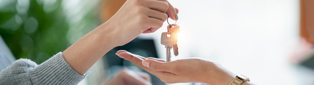 Handing over house keys on completion day