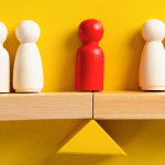 Figures on a scale representing breach of fiduciary duty