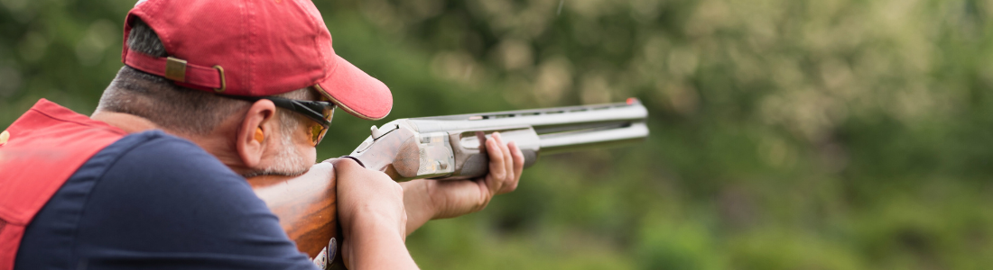 Man with shotgun enjoying sporting rights on rural land