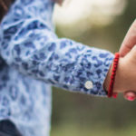 Parent and child holding hands