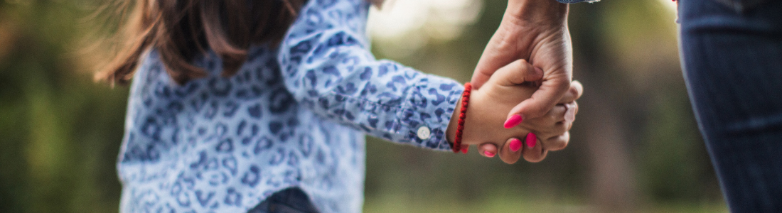 Parent and child holding hands